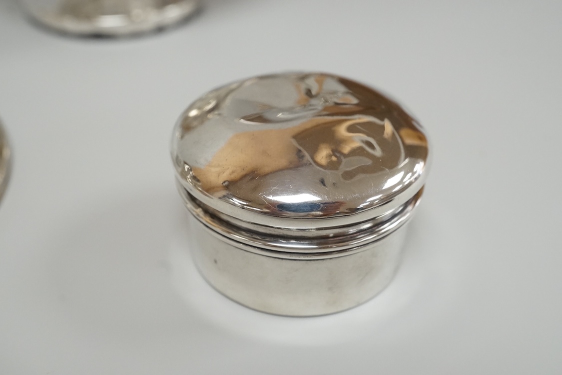 A George V silver mounted capstan inkwell, A & J Zimmerman Ltd, Birmingham, 1913, diameter 11.4cm, together with a small silver bowl, a small silver 'dish ring' salt(a.f.), a silver two handled bowl, a silver pill box an
